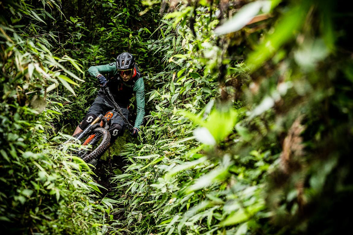 Mountain biking through jungle in Ecuador